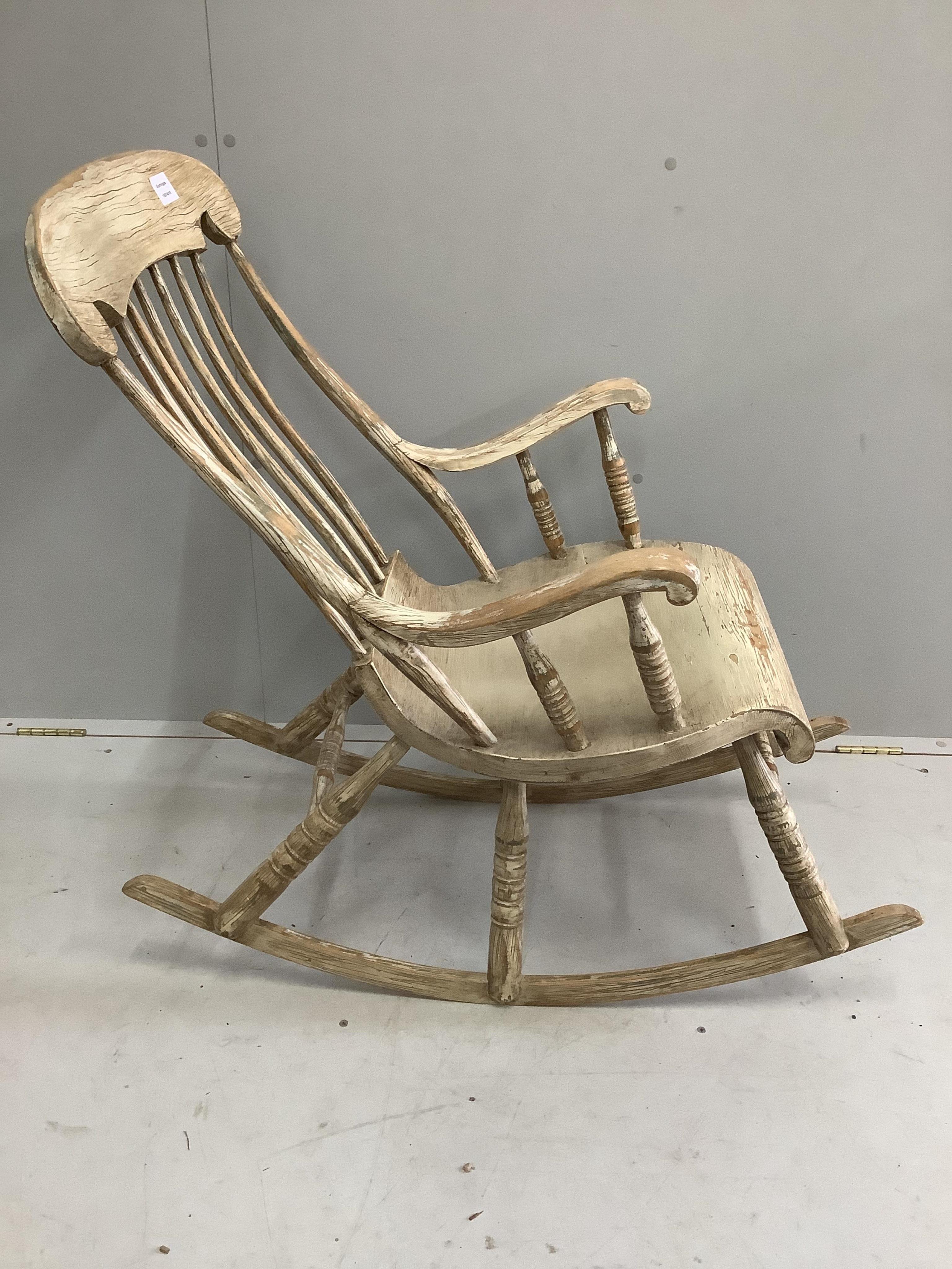 An American style painted pine rocking chair, width 56cm, depth 96cm, height 94cm. Condition - good